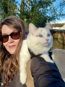 Marshmallow the Ragdoll sitting on owners shoulders