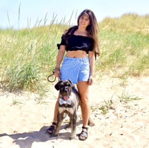 Jurgen the Giant Schnauzer at the beach with his owner
