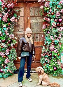 Cavapoo with its owner at christmas